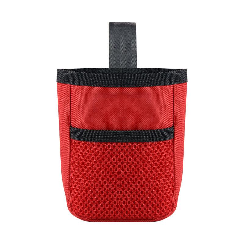 Bolsa de treino para cães em vermelho, confeccionada em material Oxford, com detalhes em preto e malha na base.