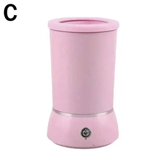 Copo limpador automático de patas de cão, em rosa, design cilíndrico com base arredondada e botão de operação.
